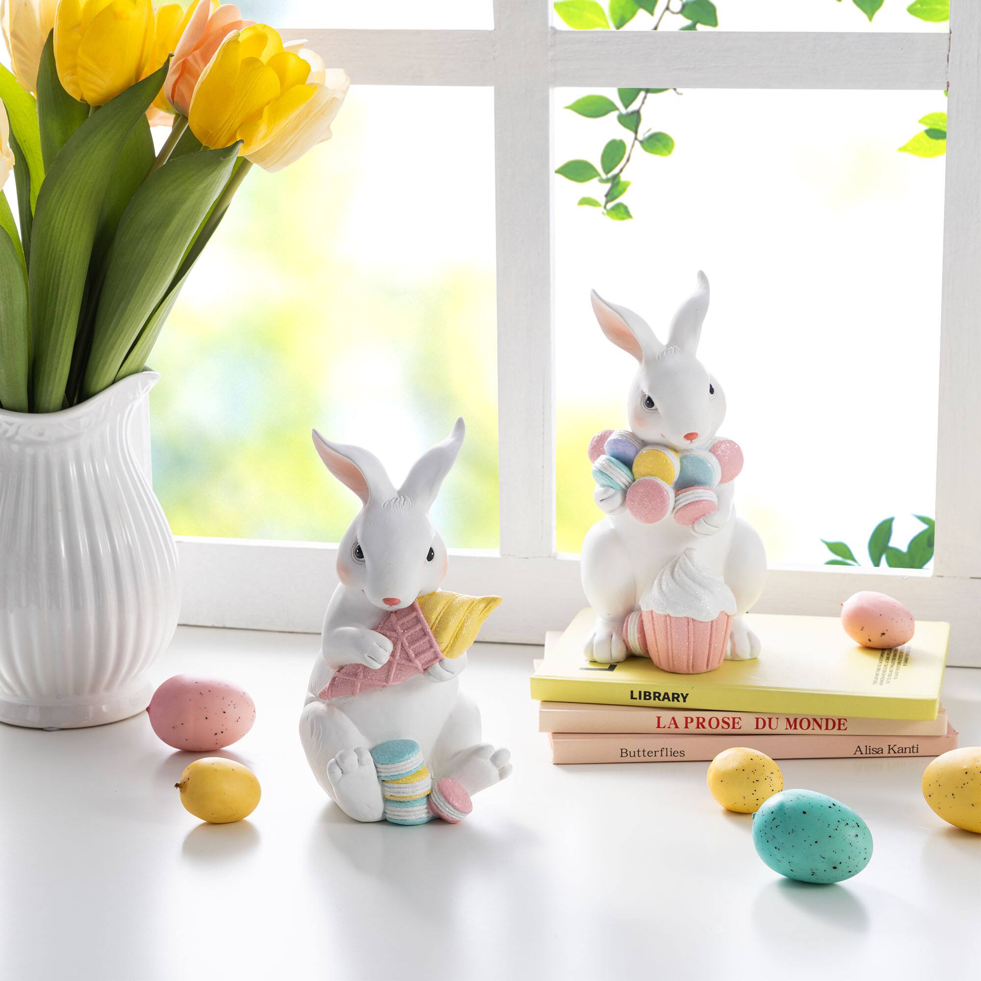 Glitzhome® Set of 2 Easter Resin Bunny Holding Macaron Table Decor